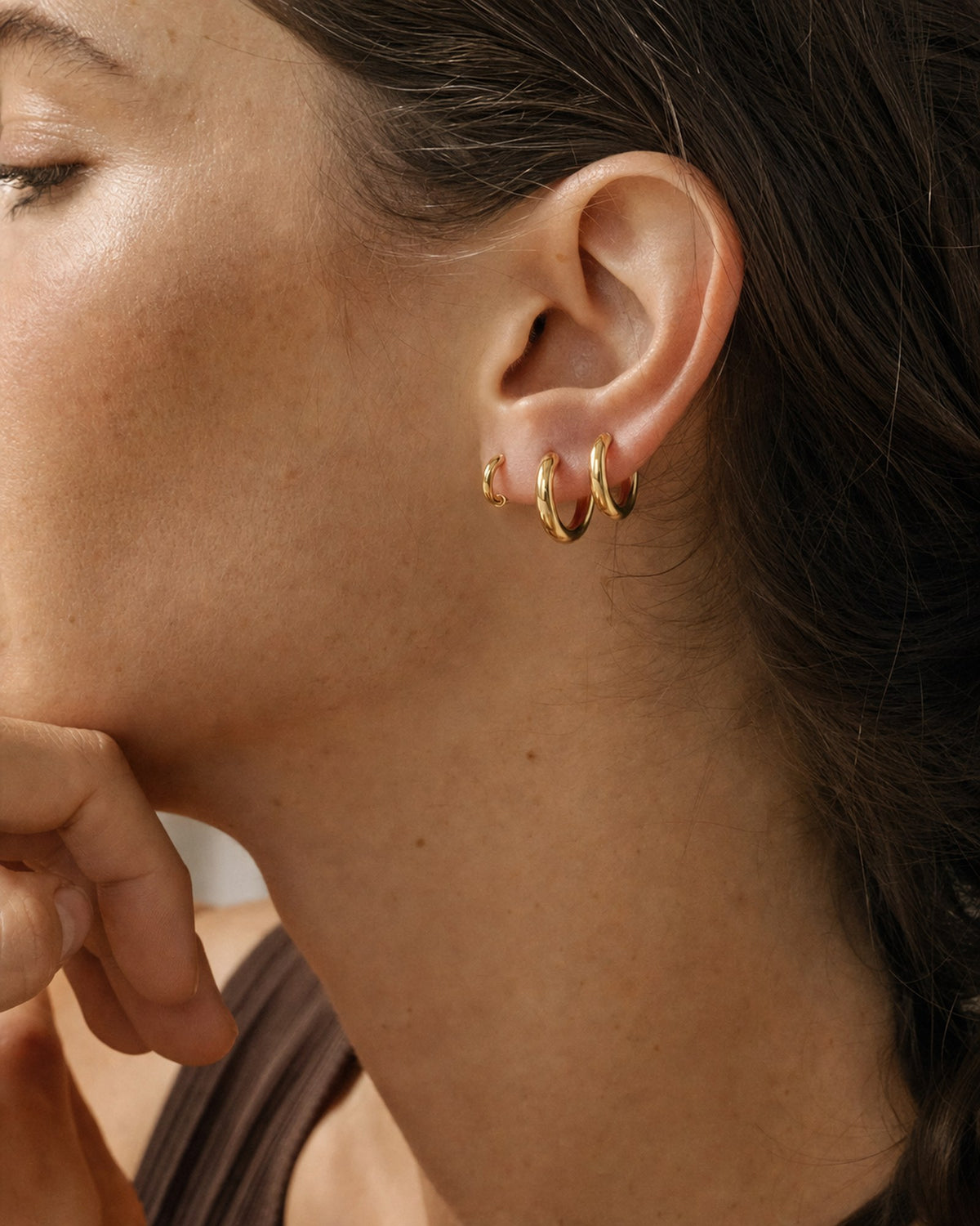 Everyday Gold Huggie Hoop Set styled and in use
